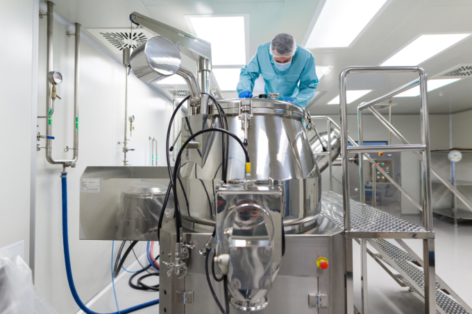 scientist look in steel tank in laboratory